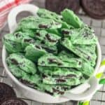 small white bowl full of mint Oreo bark - 11