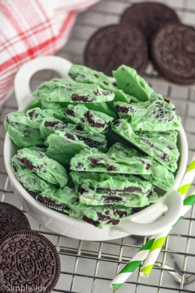 small white bowl full of mint Oreo bark