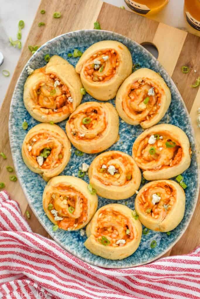 overhead of a platter of buffalo chicken pinewheels