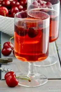a glass of cherry sangria