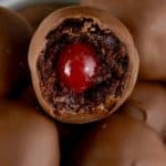 These Chocolate Covered Cherry Brownie Bombs are delicious bites of brownie surrounding cherries and then dipped in chocolate!  These are the perfect treat to make and give!