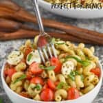 bowl of pesto pasta salad with fork coming out