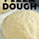 ball of pizza dough on a floured surface