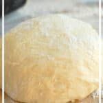 ball of pizza dough on a floured surface