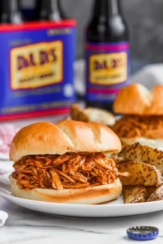 crock pot bbq chicken sandwich on a plate made with root beer