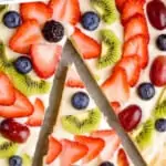 pinterest graphic of overhead view of a close up of a slices of fruit pizza recipe