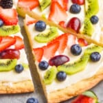 pinterest graphic of side view of a slice of sugar cookie fruit pizza