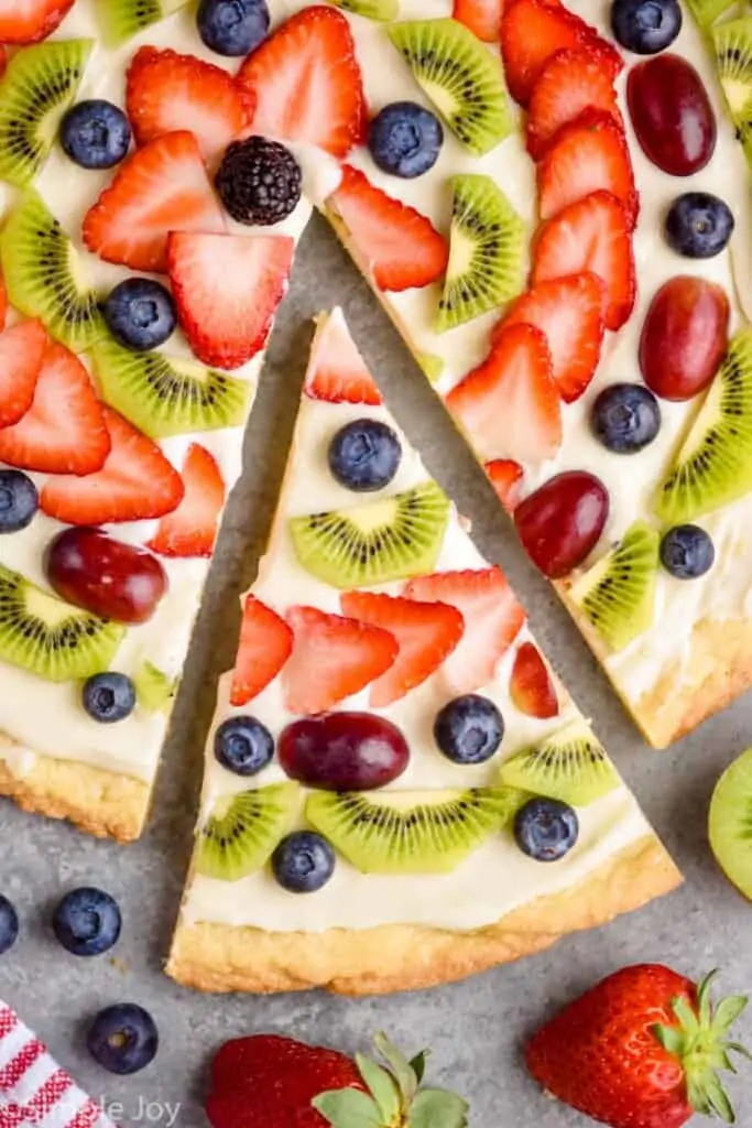 overhead view of a close up of a slices of fruit pizza recipe