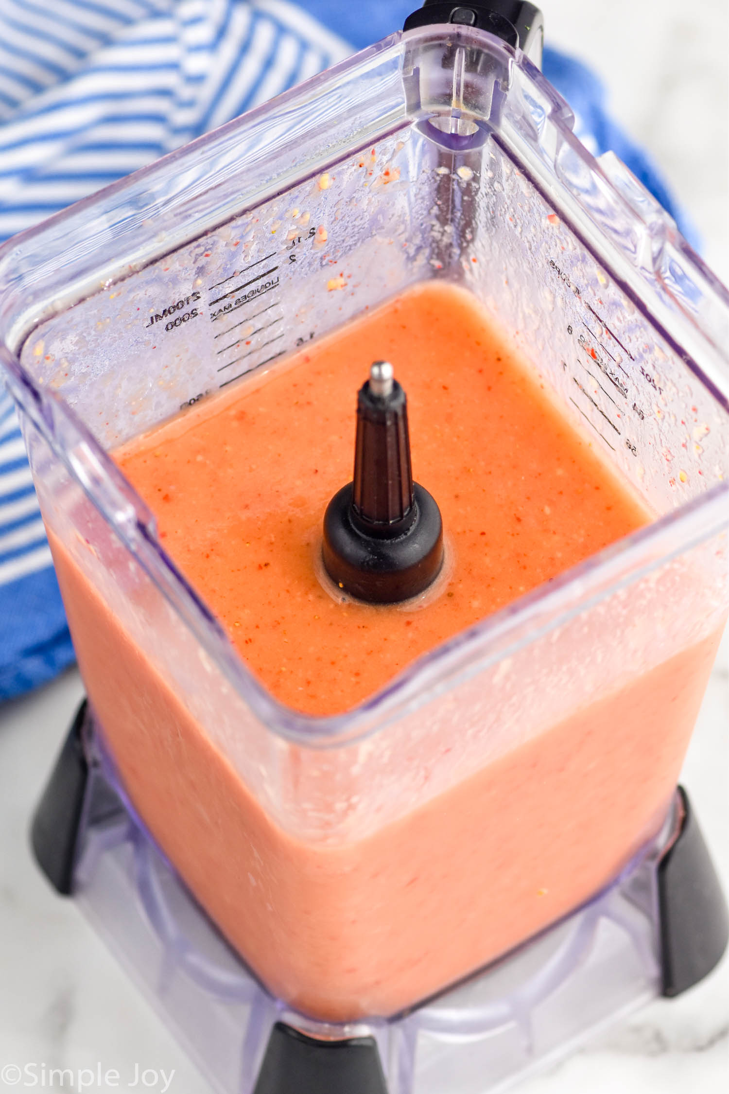 Overhead photo of Strawberry Mango Margaritas recipe in a blender.
