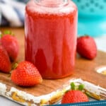 pinterest graphic of a small corked bottle holding strawberry syrup