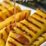 cinnamon honey sauce being drizzled over grilled pineapple spears
