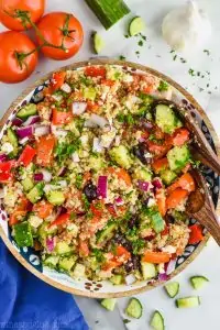 overhead view of Mediterranean quinoa in a wood bowl