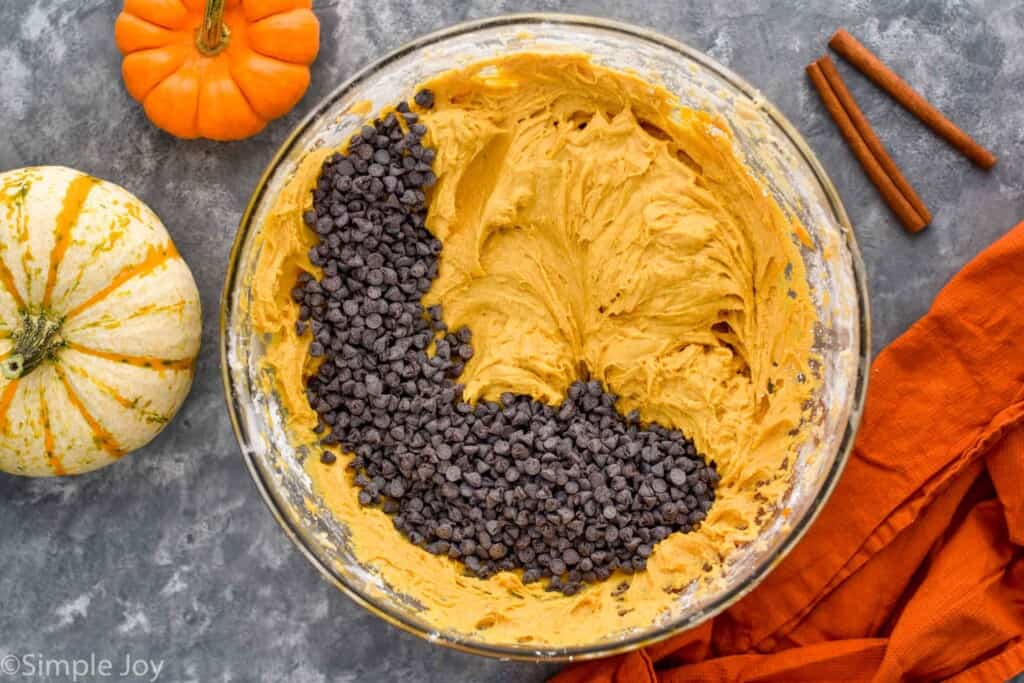 overhead of orange batter like mixture with mini chocolate chips poured on top