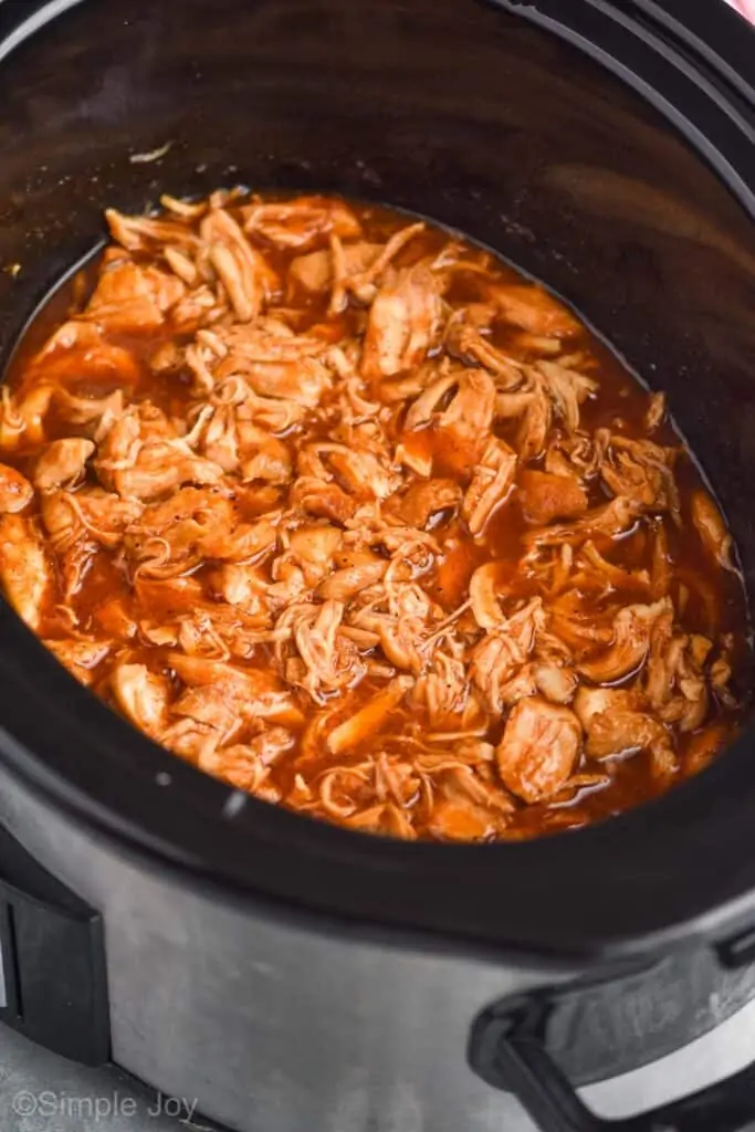 side view of slow cooker bbq chicken in a crockpot