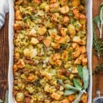 overhead view of the best homemade stuffing recipe garnished with fresh sage