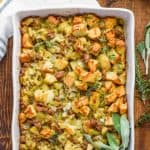overhead view of the best homemade stuffing recipe garnished with fresh sage