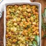 overhead view of the best homemade stuffing recipe garnished with fresh sage