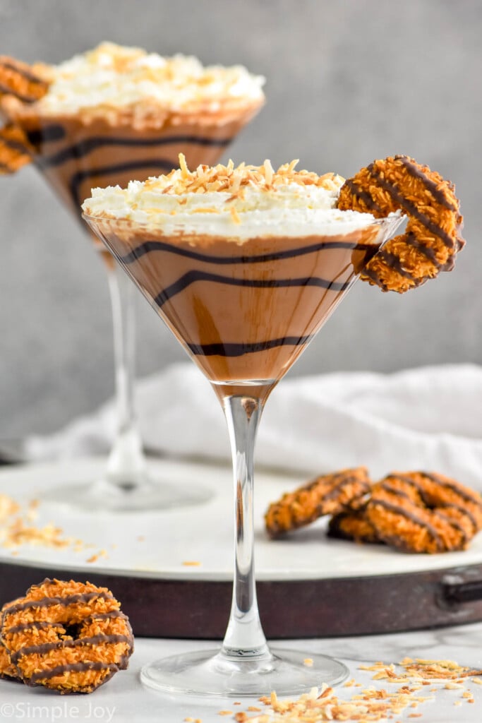 Photo of Samoa Martinis garnished with Samoa cookies.