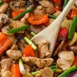 Serving spoon digging into a skillet of easy szechuan chicken - 25