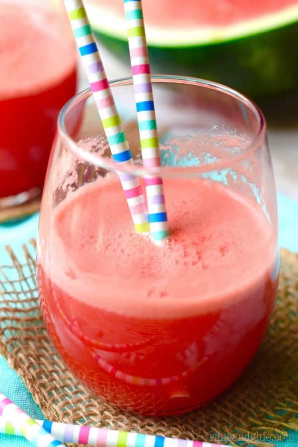 In a glass cup, the Watermelon Coconut Agua Fresca has a pink red color. 