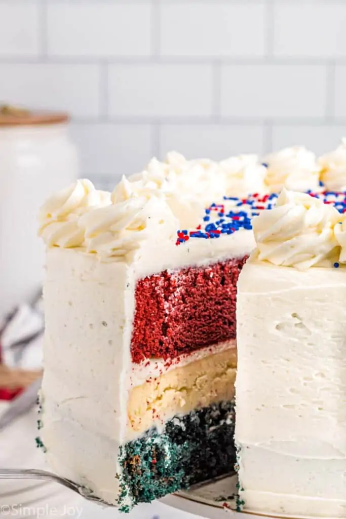 a flag cake with a slice coming out