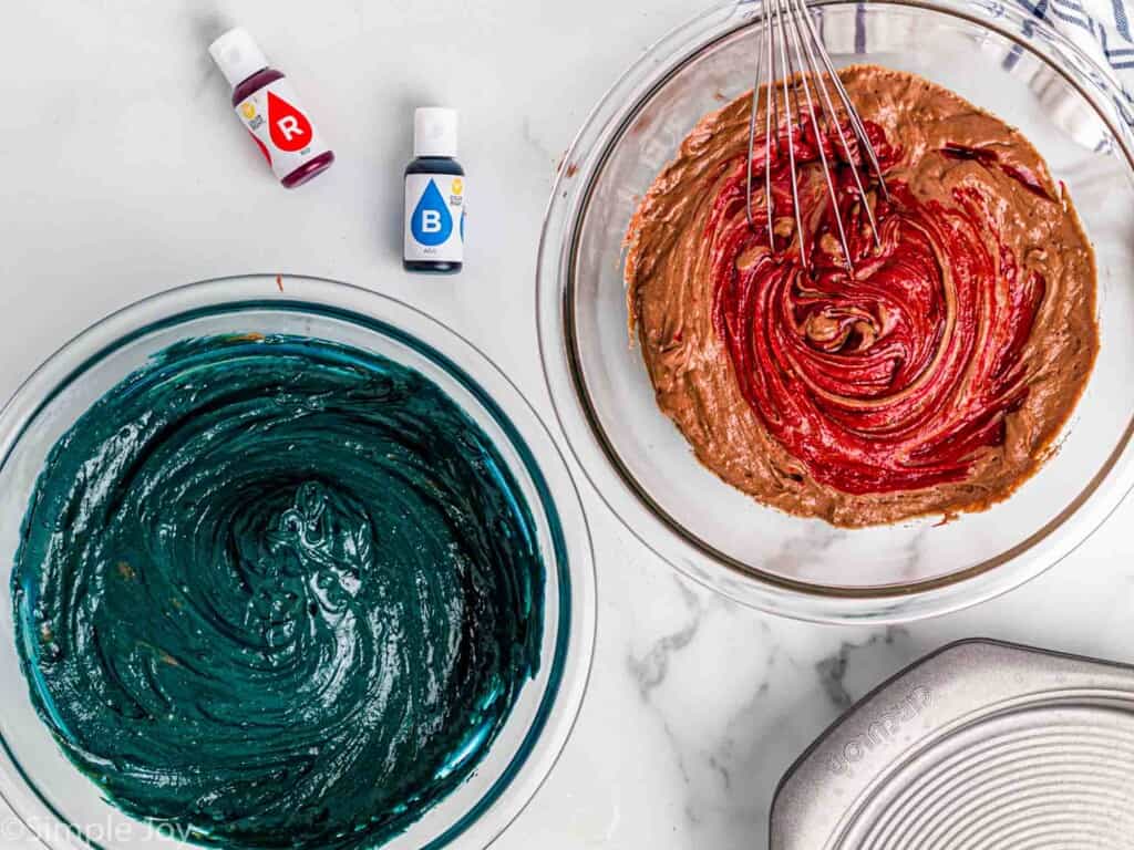 overhead of batter being mixed together for red and blue velvet cake