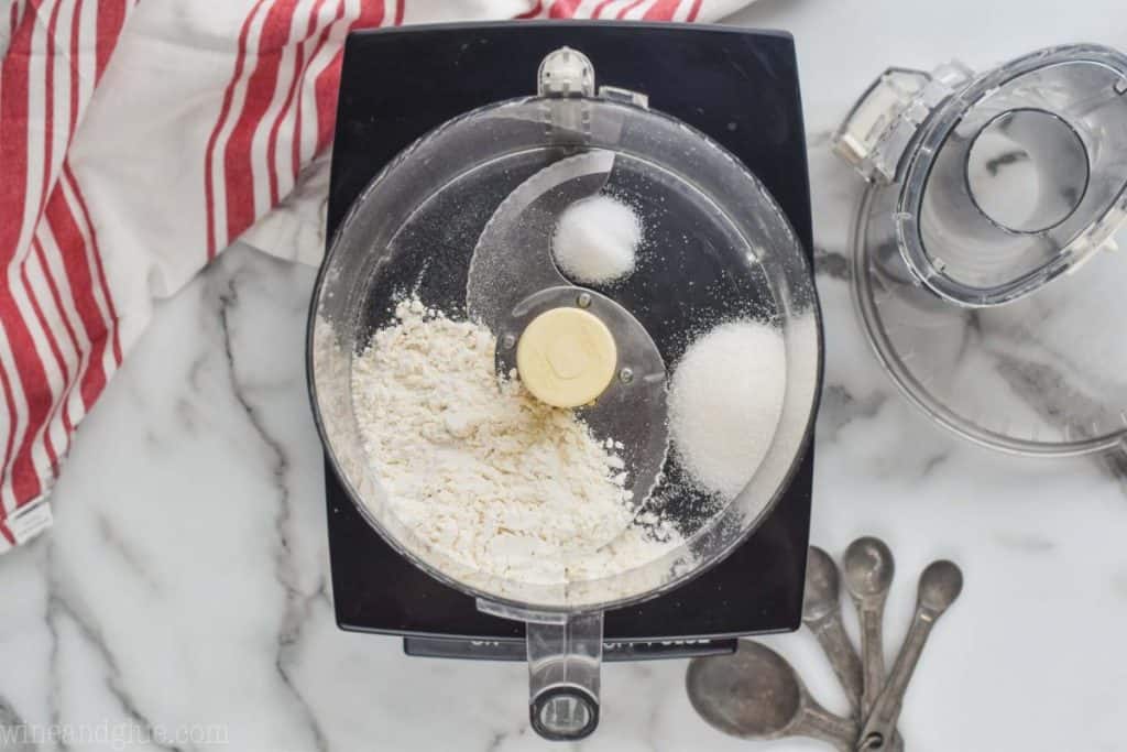 overhead view of a food processor with flour, sugar, and salt to create an easy pie crust - 18