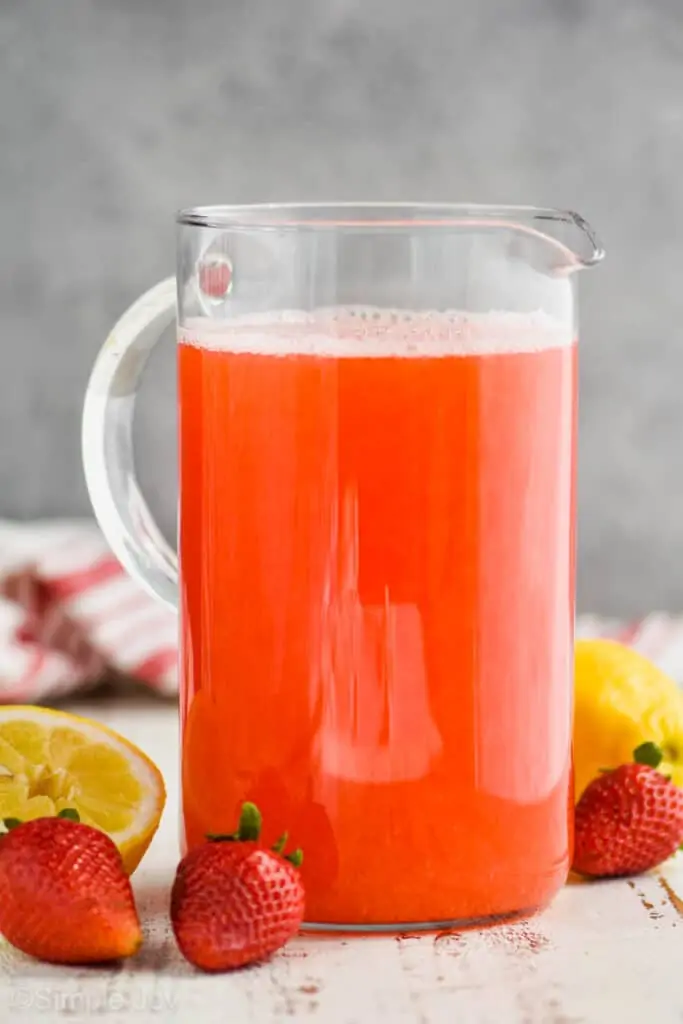 large glass pitcher of strawberry lemonade