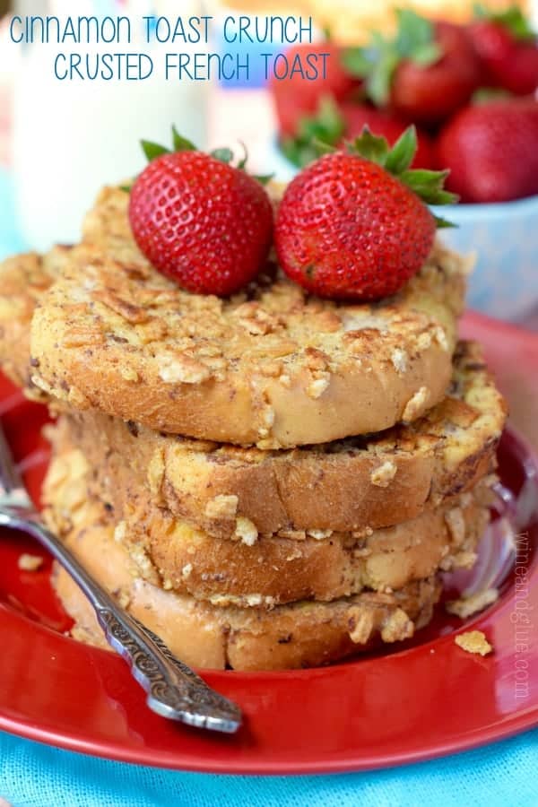 A stack of 4 Cinnamon Toast Crusted French Toast with two Strawberries on top
