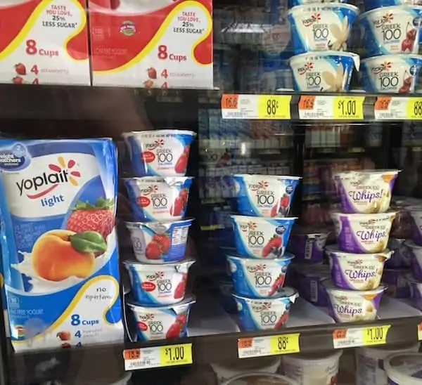 Stacks of light Yoplait yogurt flavored peach and strawberry at the grocery store.