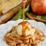 apple cobbler recipe on white plate with ice cream and caramel