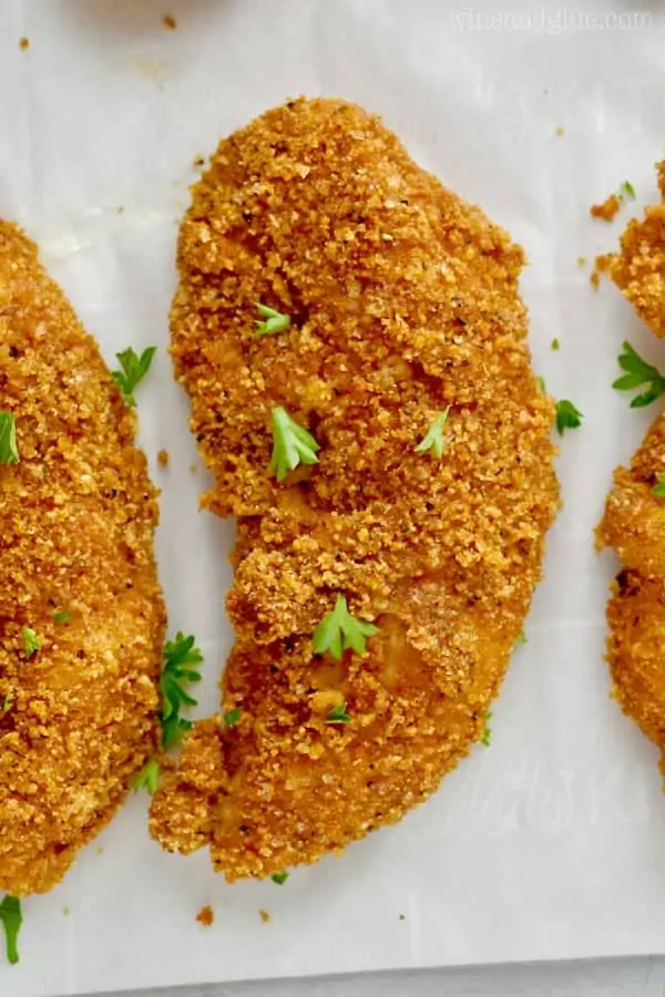 An overhead photo of the Baked Chicken Tenders has a golden brown crispy exterior. 