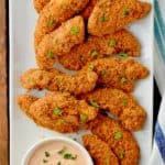 This Baked Chicken Tenders Recipe with Easy Dipping Sauce need to be part of your weeknight dinner line up!  This chicken tender recipe is so delicious and way lighter than traditional fried chicken tenders and barbecue sauce.