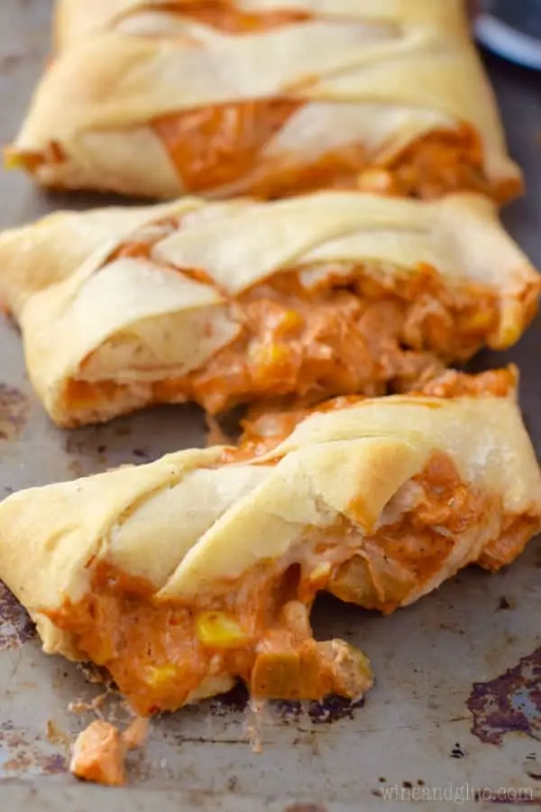 Chicken Enchilada Crescent Braid cut into slices on a baking pan. 