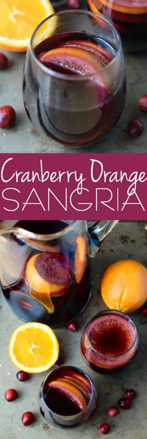 The Cranberry Orange Sangria are in a tumbler wine glass with a dark purple complexion. 