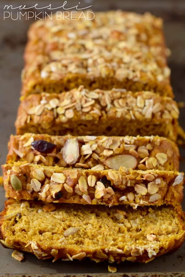 The Muesli Pumpkin Bread are cut into slices and the top of the bread is sprinkled with different types of seeds and nuts. 