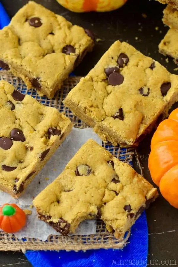 An overhead photo of the Pumpkin Brown Butter Cookie Bars that are shaped as little squares with dots of chocolate chips.