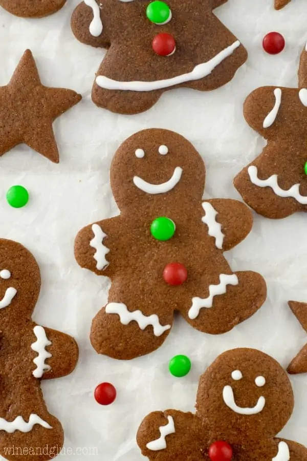 An overhead photo of the Gingerbread Cookies shaped as little people with smilie faces and mini M&Ms as little buttons. 