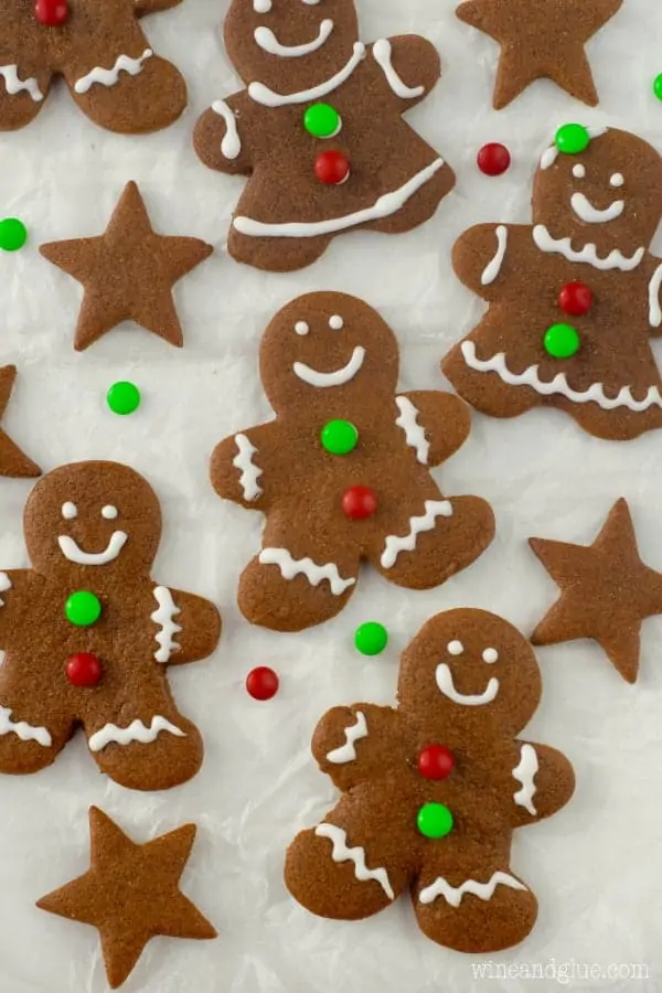 An overhead photo of the Gingerbread Cookies shaped as little people with smilie faces and mini M&Ms as little buttons. 