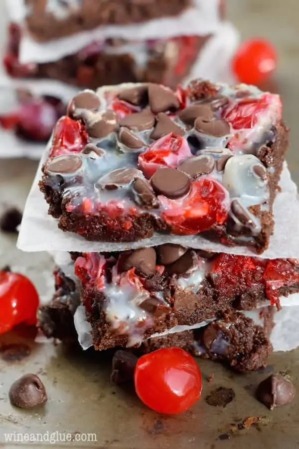 An overhead photo of the Chocolate Covered Cherry Magic Bars Stalk showing the bright red color from the maraschino cherry, chocolate chips, and a condensed milk glaze. 