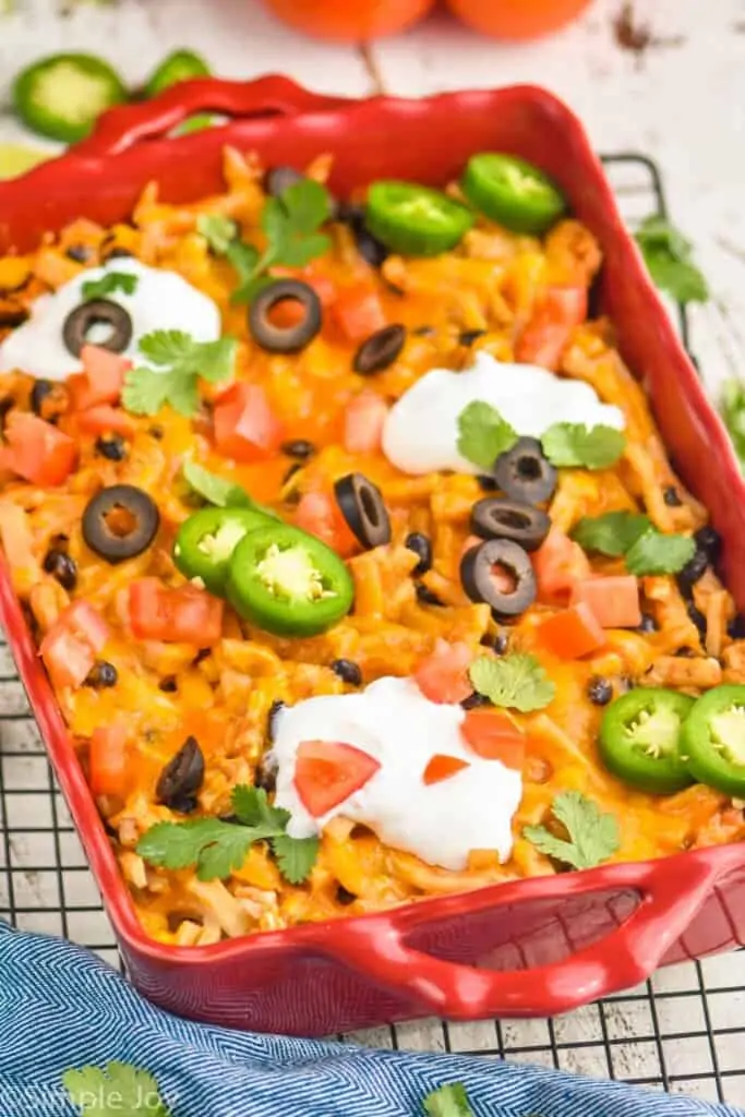 side view of an easy taco casserole in a red baking dish