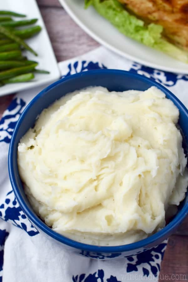 In a blue bowl, the Easy Ranch Potatoes are creamy and fluffy. 