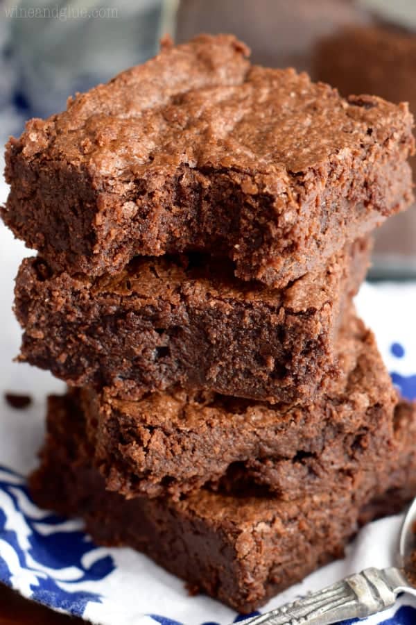 The Mocha Fudge Brownie is stacked showing the moist fudge middle and crisp top. 