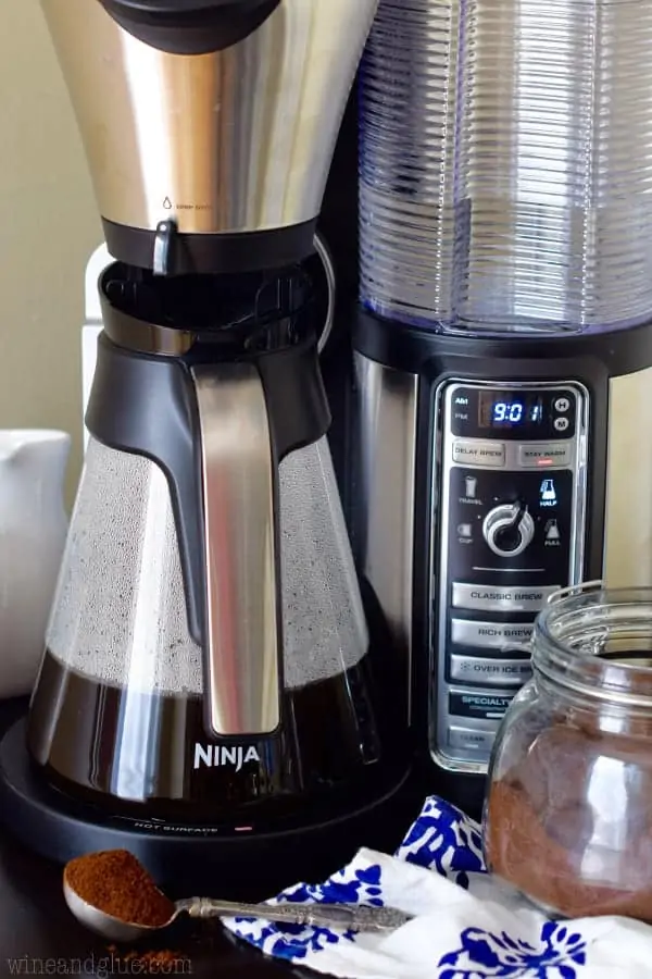 The Ninja Coffee Bar is brewing some coffee into a coffee pot. 