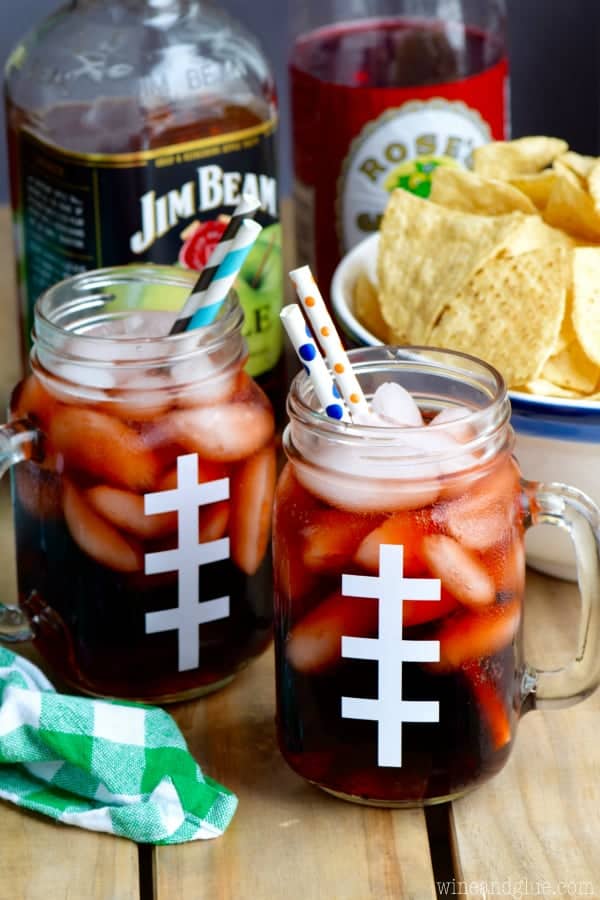 Two glasses of the Super Bowl Slammers in football looking mason jar glasses. 