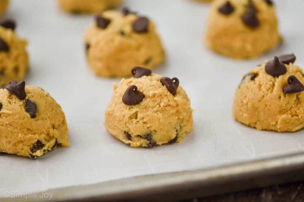 side view of dough balls of peanut butter chocolate chip cookie recipe