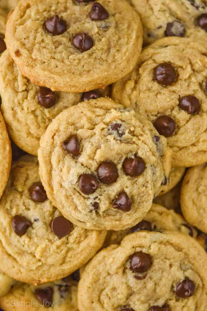 overhead photo of a large pile of peanut butter chocolate chip cookies