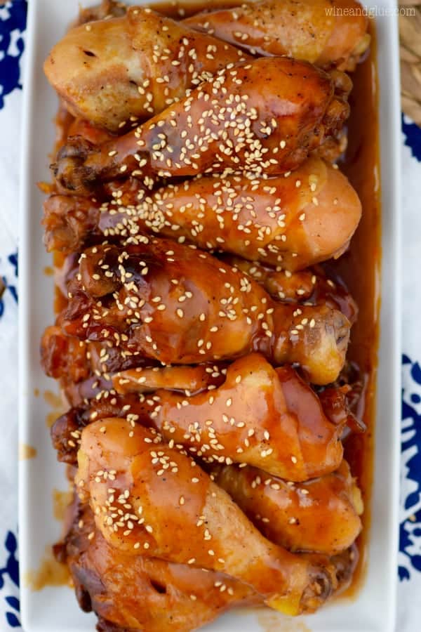 An overhead photo of the Slow Cooker Honey BBQ Chicken Drumsticks sprinkled with white sesame seeds. 
