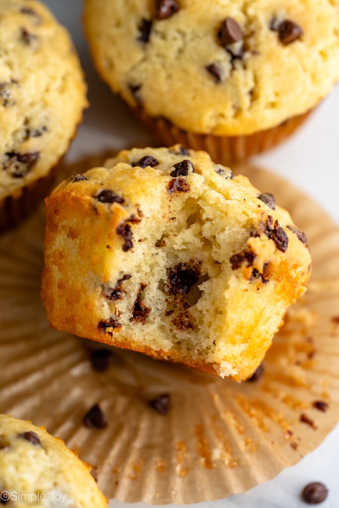 overhead view of a chocolate chip muffin with a bite missing on it's side - 10