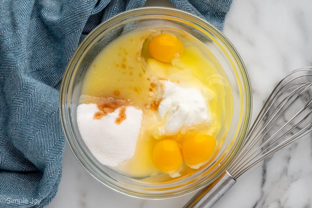 overhead of a bowl of butter, eggs, sugar, vanilla, and yogurt - 6